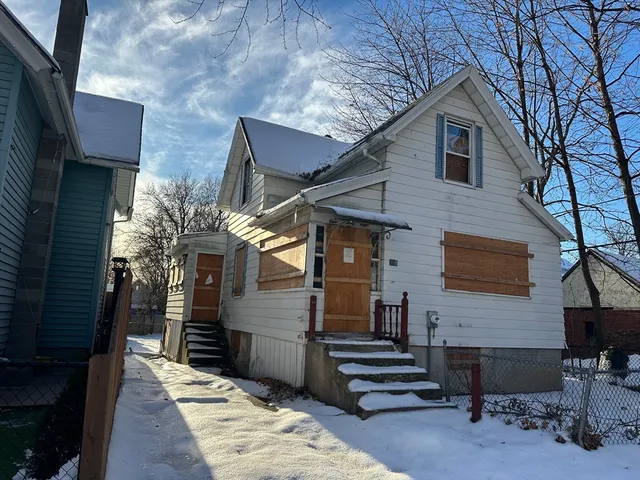 a front view of a house with a garage