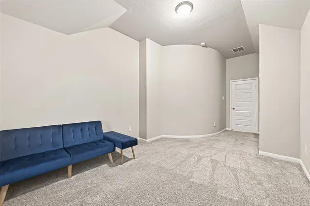 a view of a house with a yard and sitting area