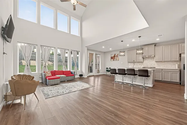 a living room with furniture and a large window