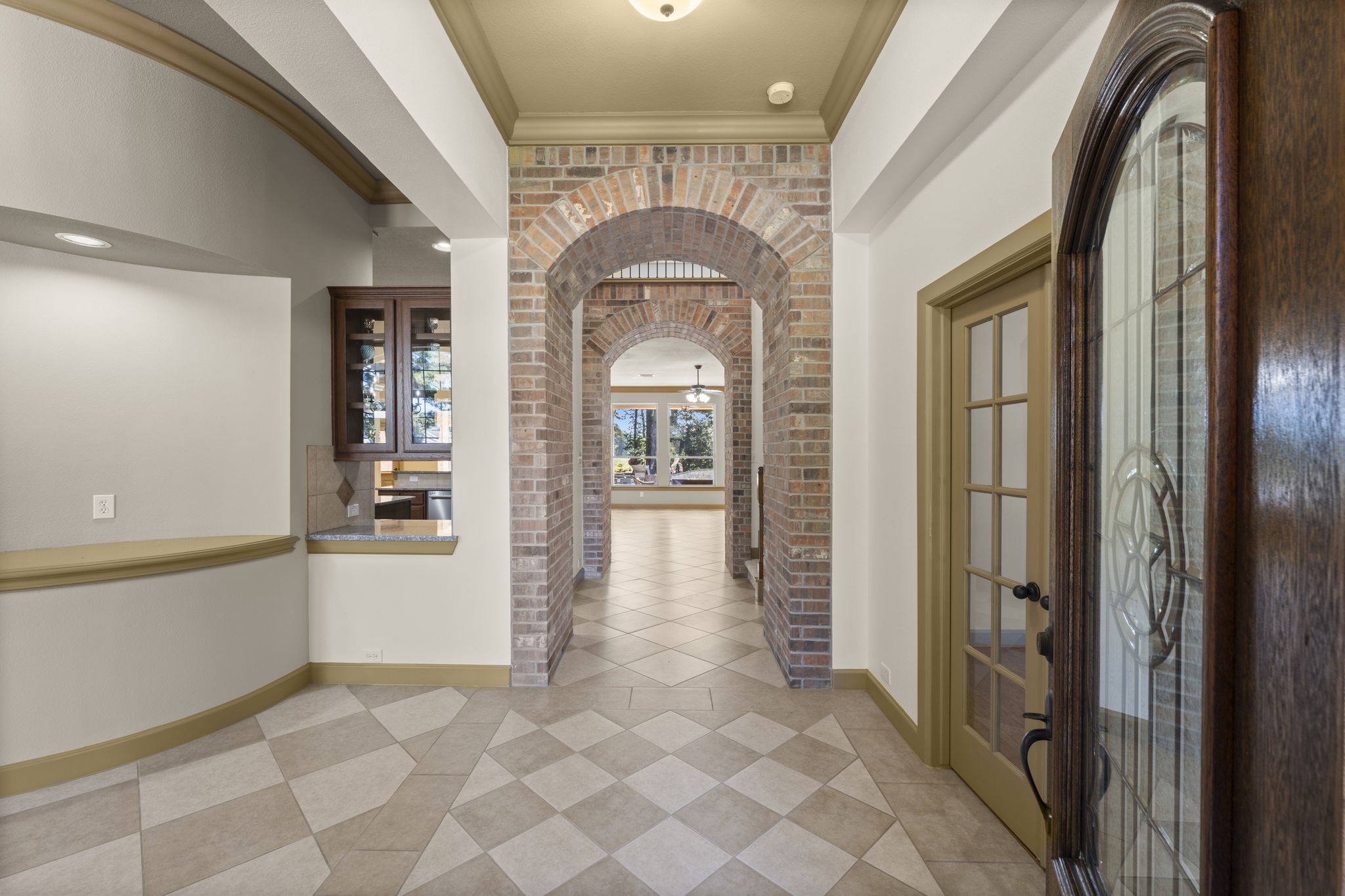 1534 Virgie Community Road Magnolia, TX 77354 - Photo 10 of 50 Such architecture and design the second you walk inside the home. A beautiful office to the right and one of the most stunning fine dining rooms to the left you will ever see.