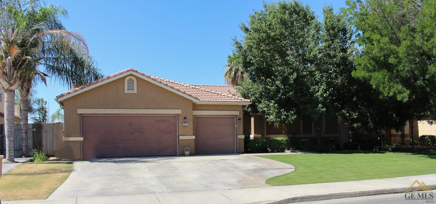 Undisclosed Address Bakersfield, CA 93311 - Photo 1 of 10 a front view of a house with a yard