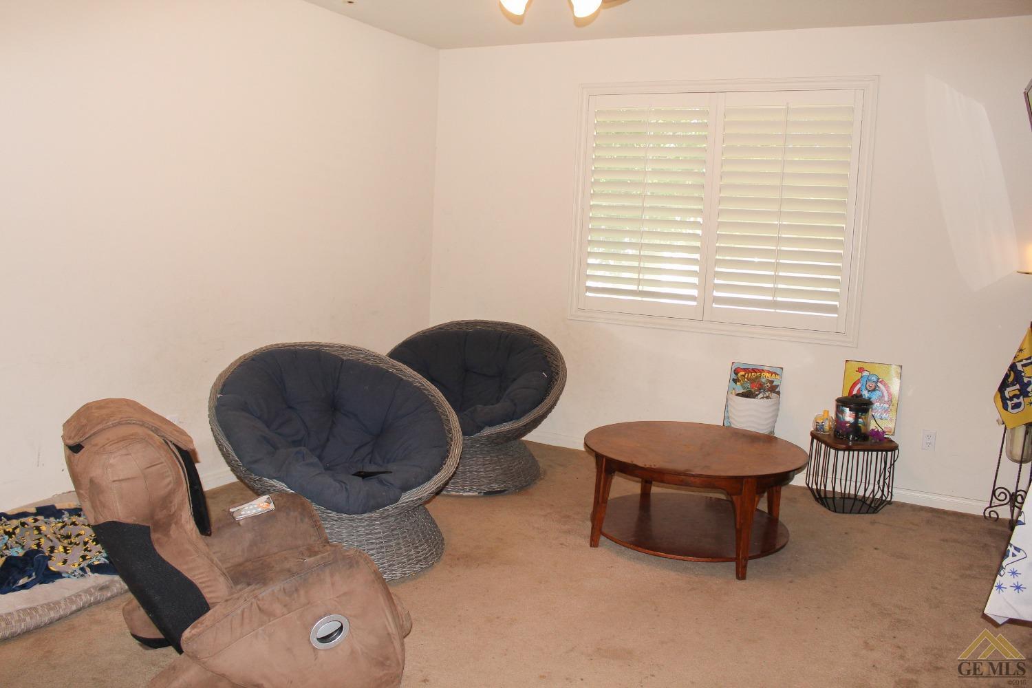 Undisclosed Address Bakersfield, CA 93311 - Photo 3 of 10 a living room with furniture and a window