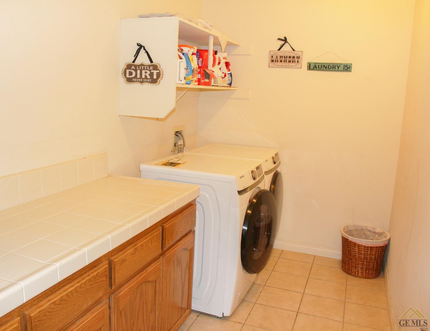 Undisclosed Address Bakersfield, CA 93311 - Photo 9 of 10 a utility room with dryer and washer