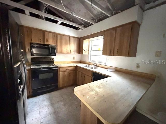 2871 West Albatross Road Avon Park, FL 33825 - Photo 8 of 11 a kitchen with stainless steel appliances granite countertop a sink a stove and a microwave