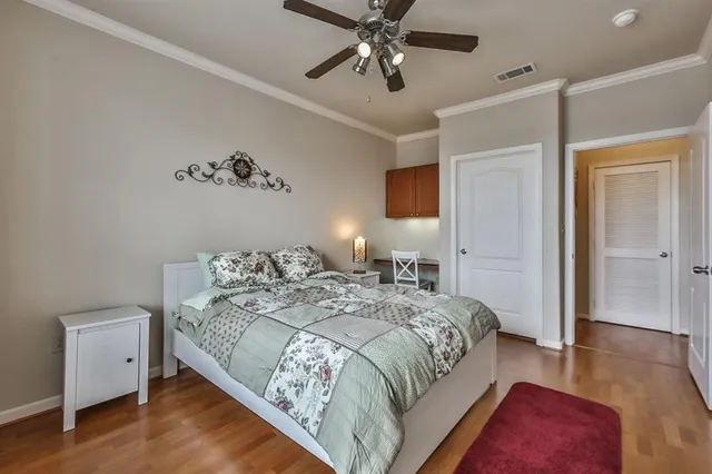 a spacious bedroom with a bed and a table