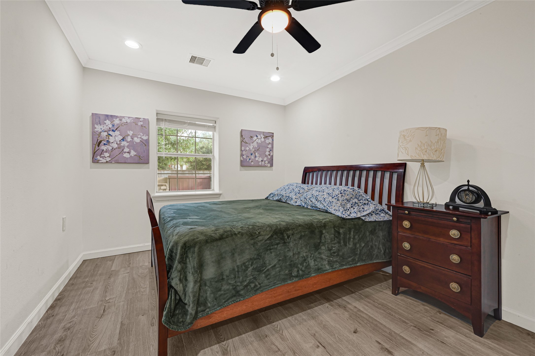 2809 Tooke Street Houston, TX 77023 - Photo 7 of 50 a bedroom with a bed and wooden floor