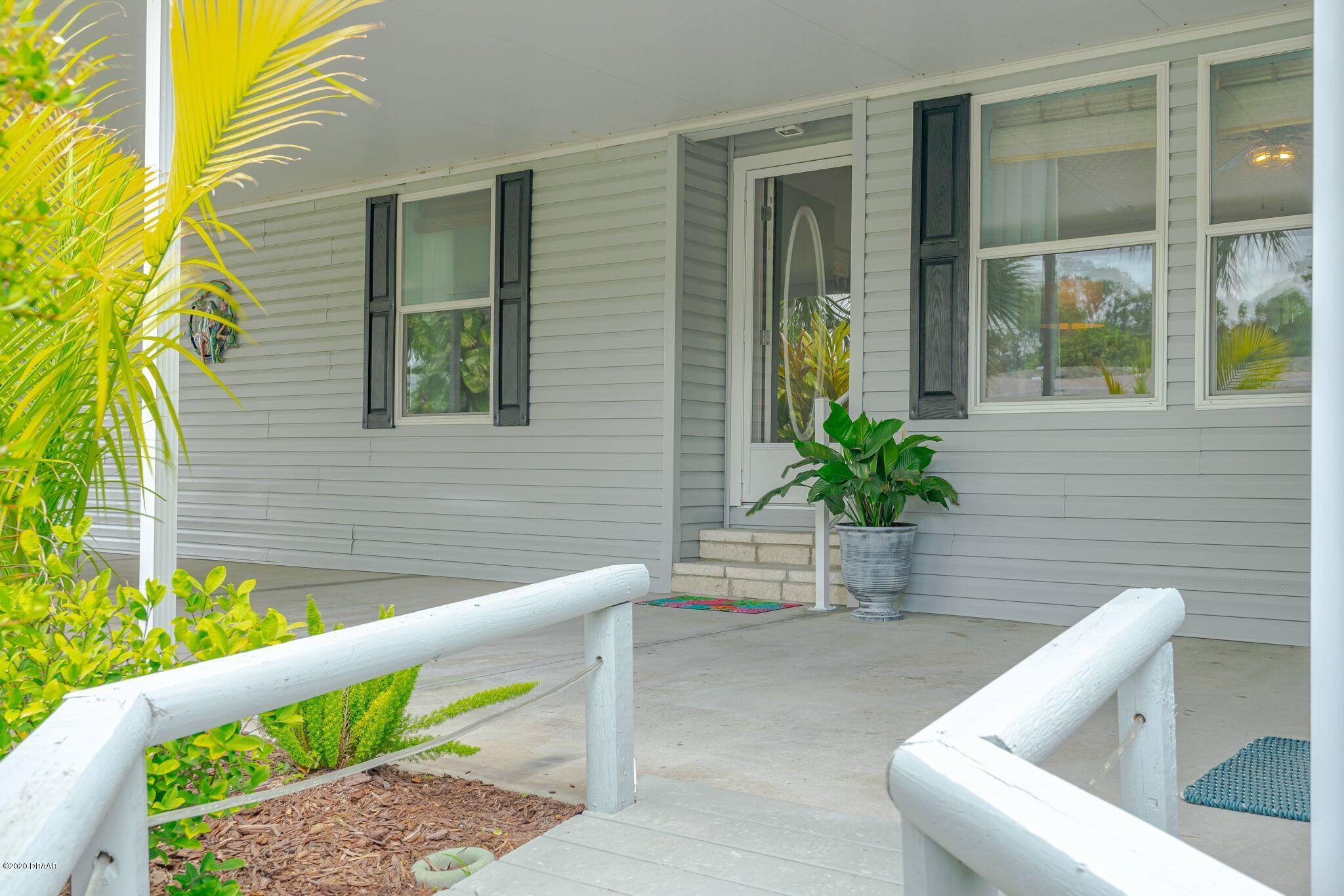 775 Navigators Way Edgewater, FL 32141 - Photo 2 of 51 Main door