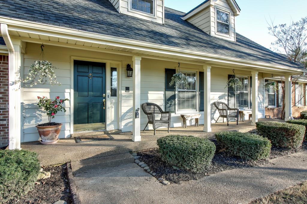 127 Baltusrol Road Franklin, TN 37069 - Photo 2 of 23 a front view of a house with outdoor seating