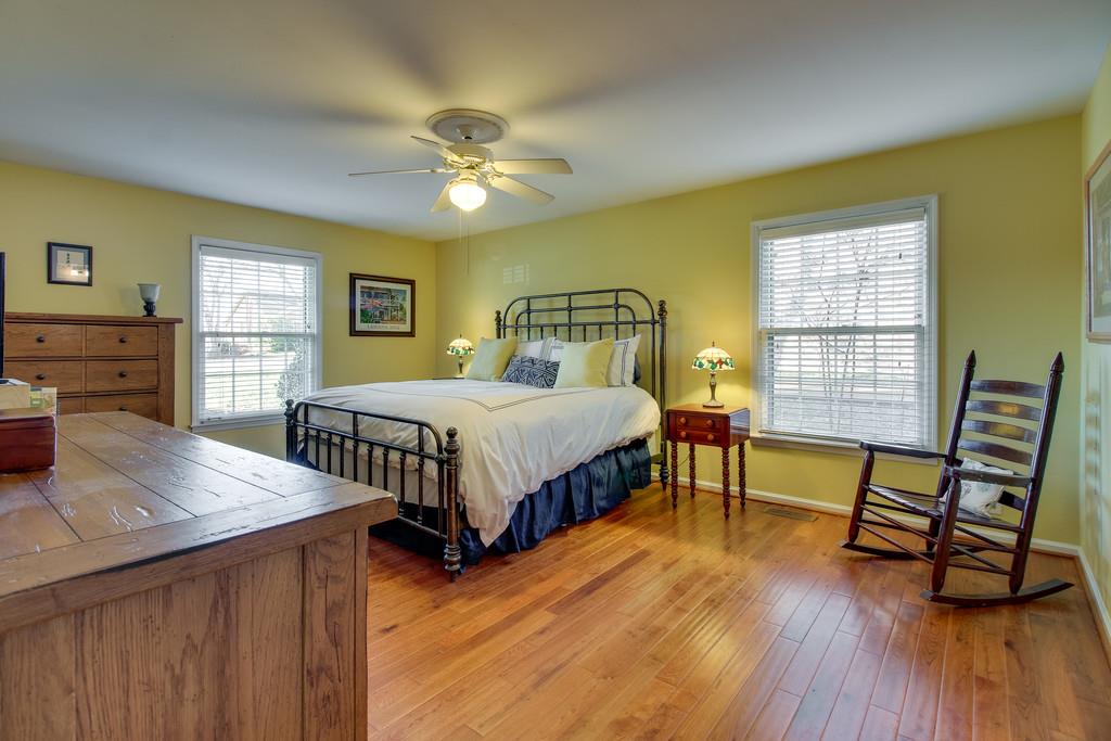 127 Baltusrol Road Franklin, TN 37069 - Photo 11 of 23 a bedroom with a bed and a table in it
