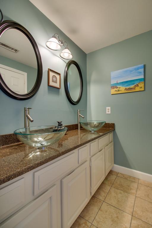 127 Baltusrol Road Franklin, TN 37069 - Photo 15 of 23 a bathroom with a granite countertop double vanity sink and a mirror