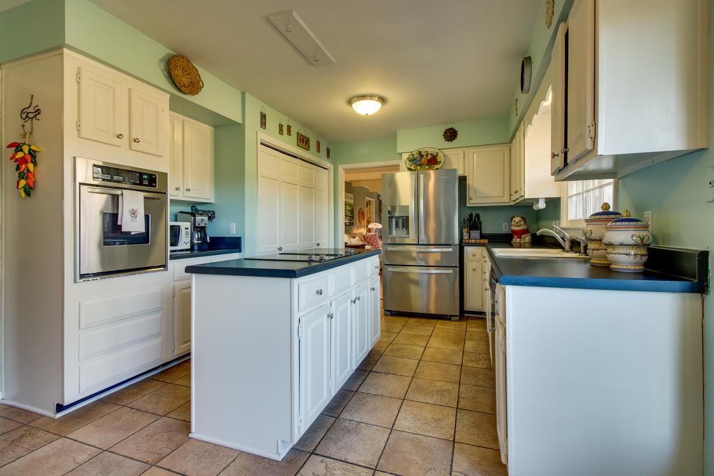 127 Baltusrol Road Franklin, TN 37069 - Photo 8 of 23 a kitchen with stainless steel appliances a refrigerator sink and cabinets