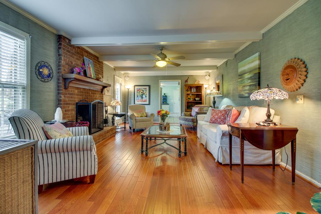 127 Baltusrol Road Franklin, TN 37069 - Photo 9 of 23 a living room with fireplace furniture and a wooden floor