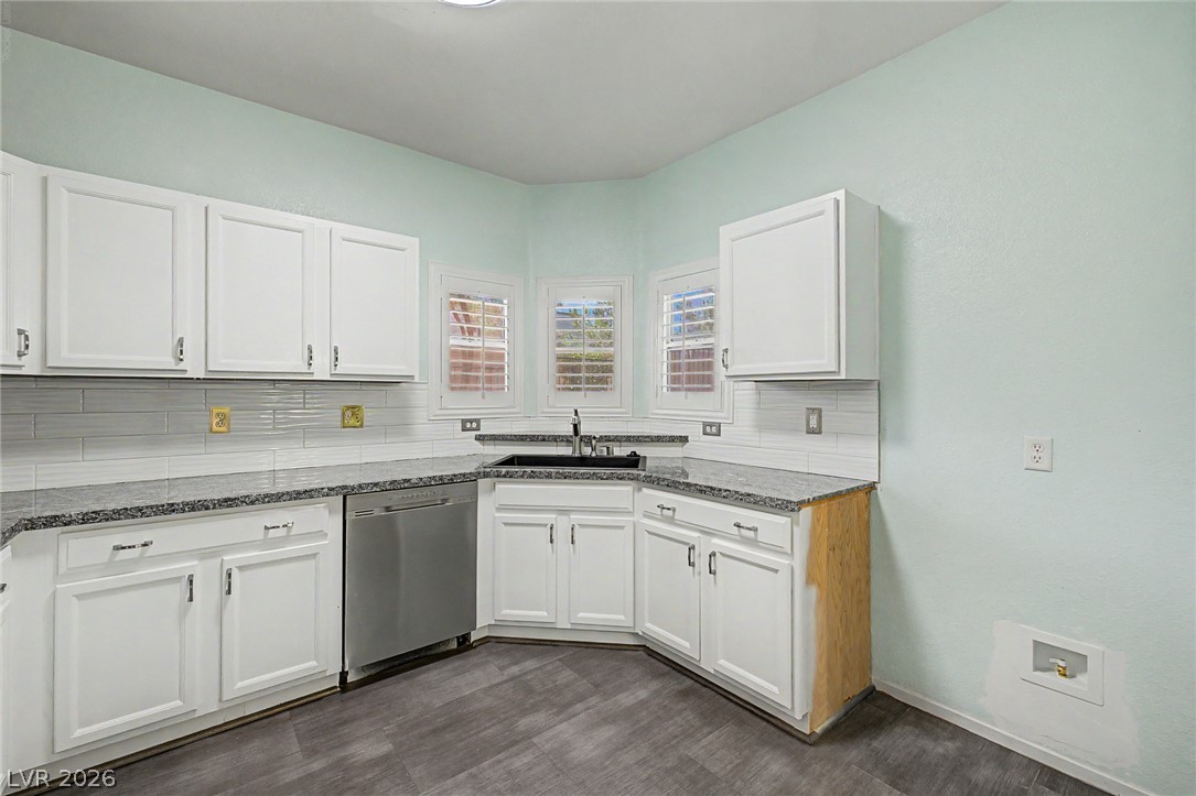 2153 Quarry Ridge Street, Unit 103 Las Vegas, NV 89117 - Photo 17 of 42 Granite counters and contemporary white cabinetry define this well-appointed culinary space.