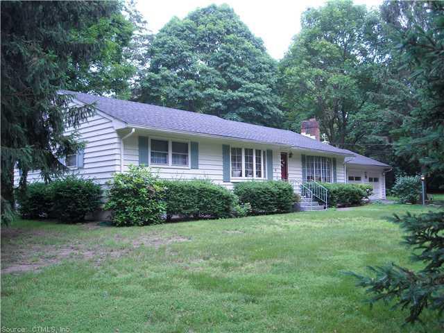 959 Mapledale Road Orange, CT 06477 - Photo 1 of 1 a front view of a house with a yard