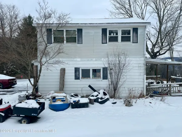 a view of a patio with couches and potted plants