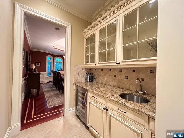 a view of a kitchen with a sink and cabinets