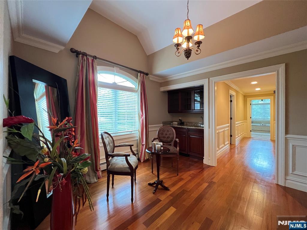 22 Reiner Place Englewood Cliffs, NJ 07632 - Photo 23 of 37 a view of a livingroom with furniture wooden floor and a chandelier