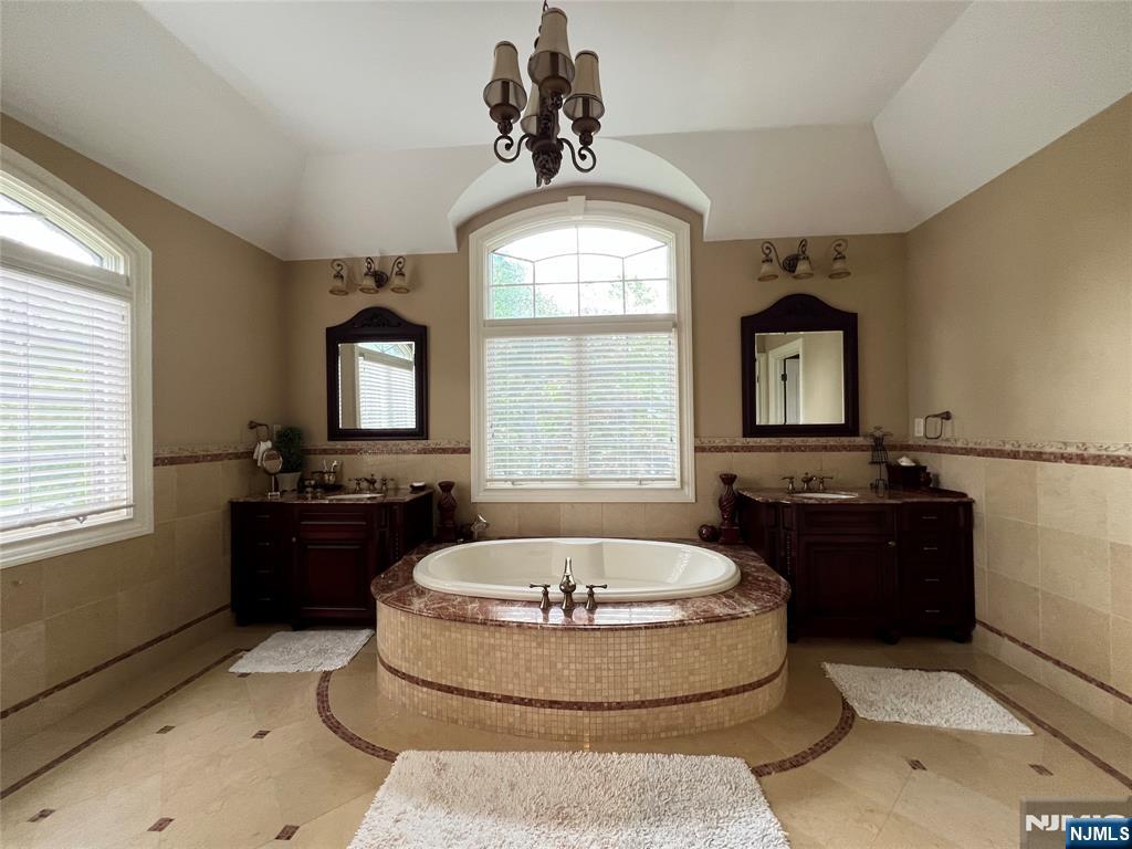 22 Reiner Place Englewood Cliffs, NJ 07632 - Photo 24 of 37 a large tub sitting in a bathroom