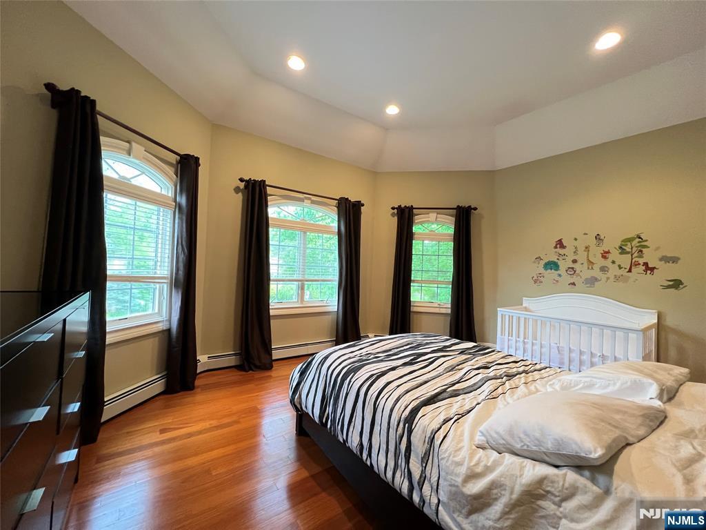 22 Reiner Place Englewood Cliffs, NJ 07632 - Photo 29 of 37 a bedroom with a large bed and a large window