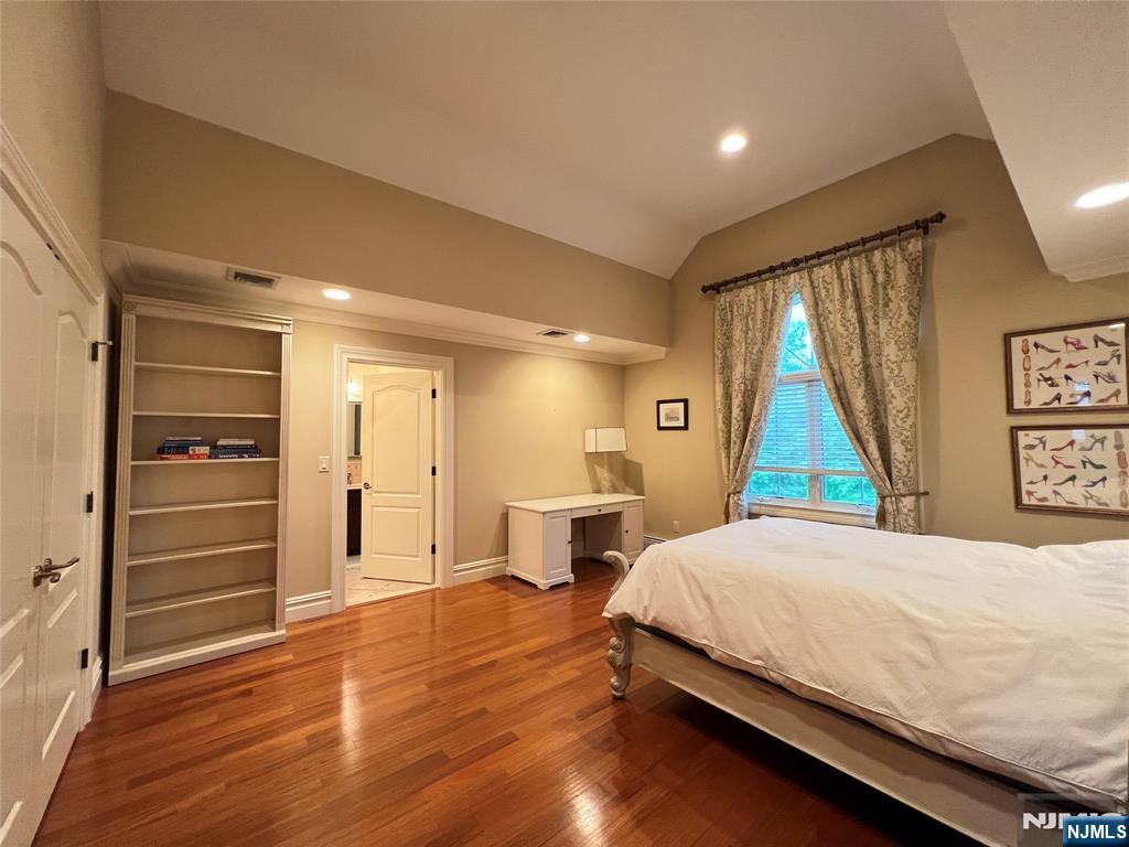 22 Reiner Place Englewood Cliffs, NJ 07632 - Photo 32 of 37 a spacious bedroom with a bed and a dresser