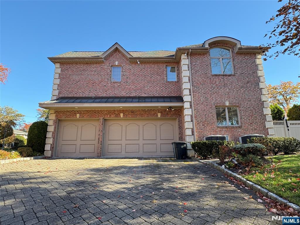 22 Reiner Place Englewood Cliffs, NJ 07632 - Photo 36 of 37 a front view of a house with a yard