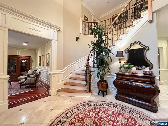 a view of entryway livingroom and hall with wooden floor