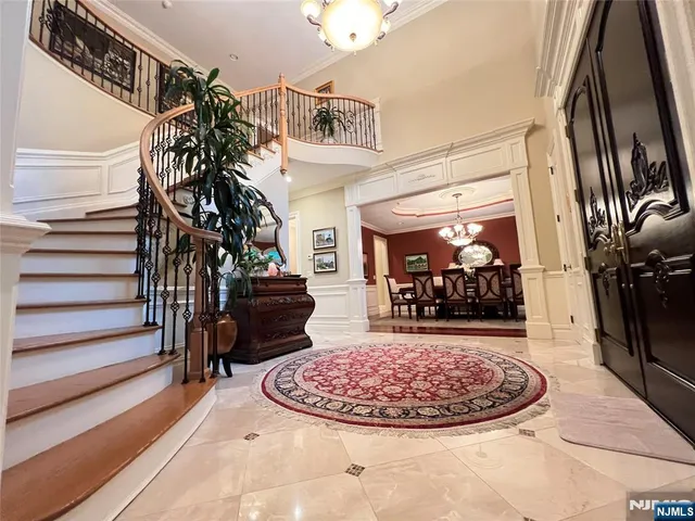 a view of a livingroom with furniture and entryway
