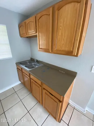 a kitchen with stainless steel appliances granite countertop a stove a sink and dishwasher