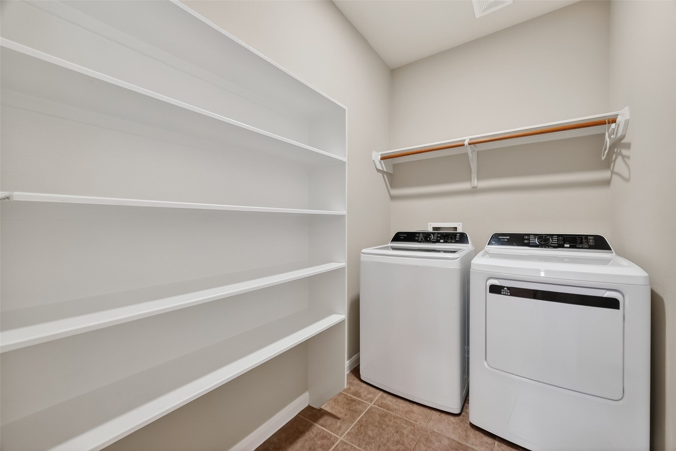22419 Toronado Ridge Lane Porter, TX 77365 - Photo 15 of 35 a view of storage and utility room with washer and dryer