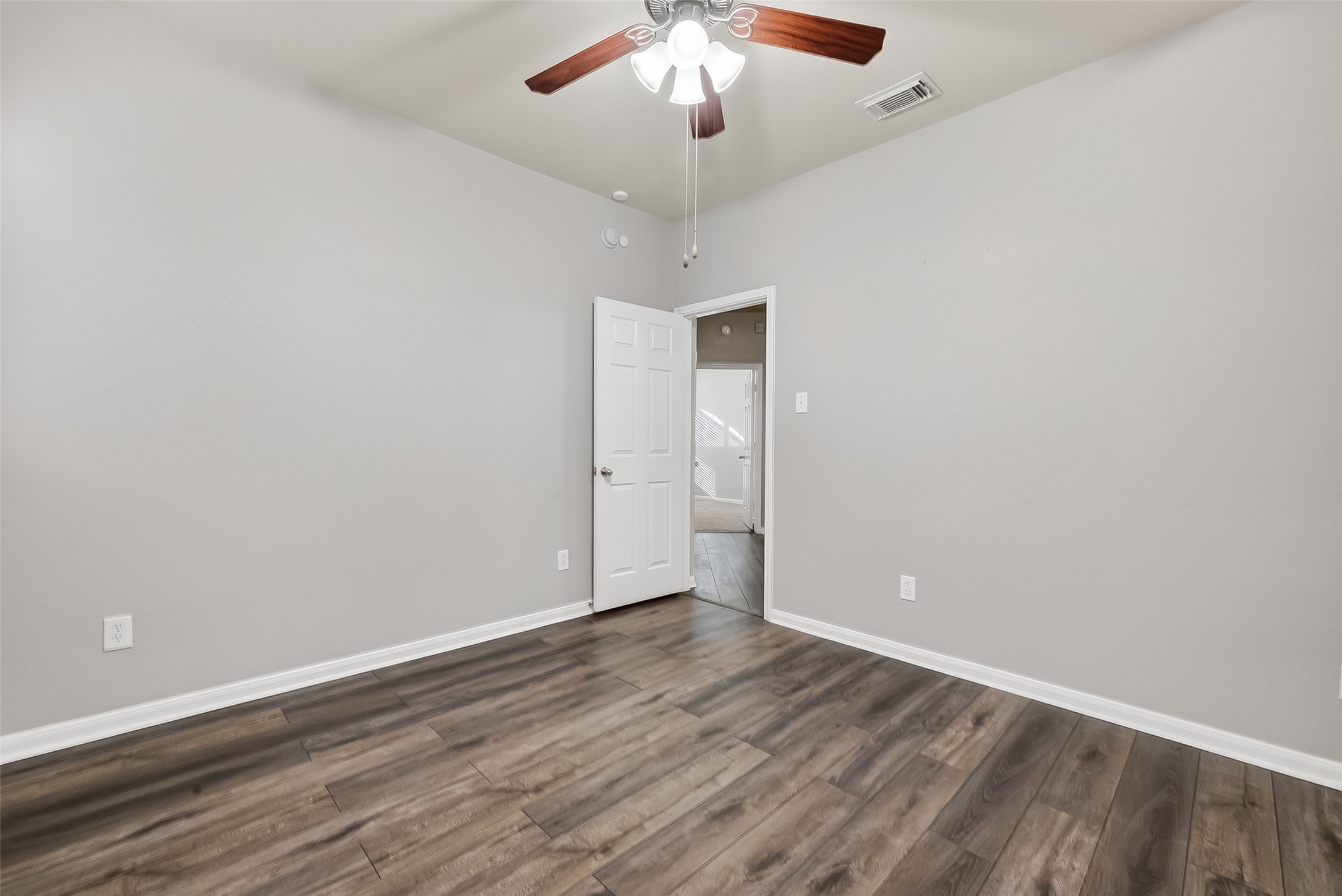 22419 Toronado Ridge Lane Porter, TX 77365 - Photo 20 of 35 a view of an empty room with wooden floor