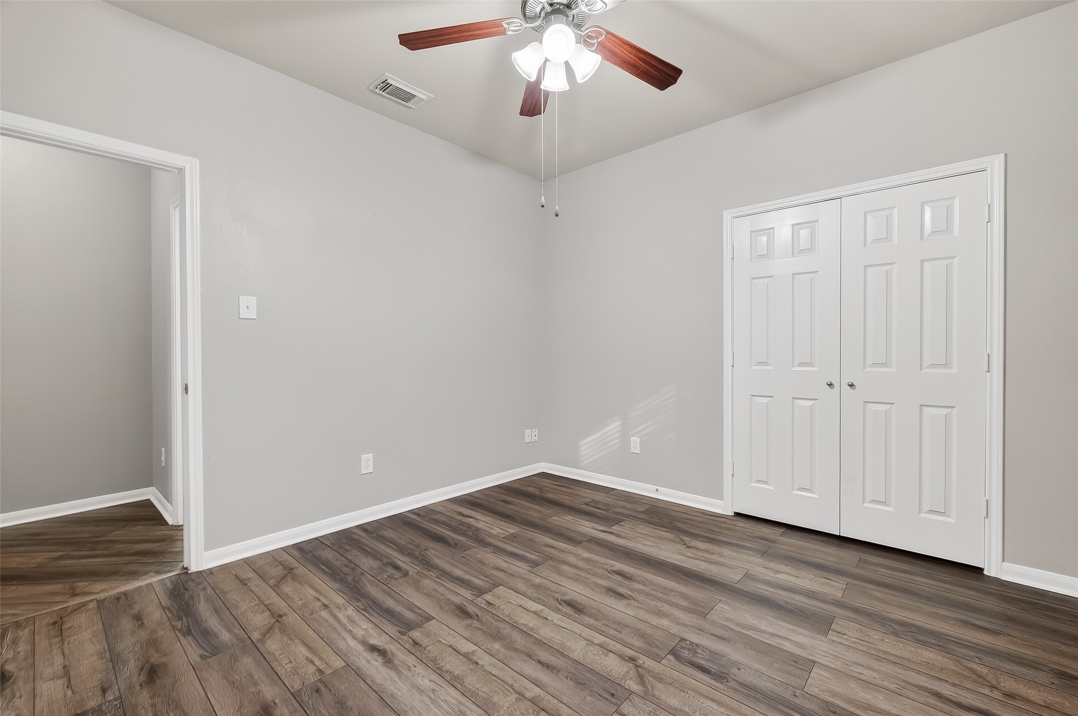 22419 Toronado Ridge Lane Porter, TX 77365 - Photo 21 of 35 a view of an empty room with wooden floor