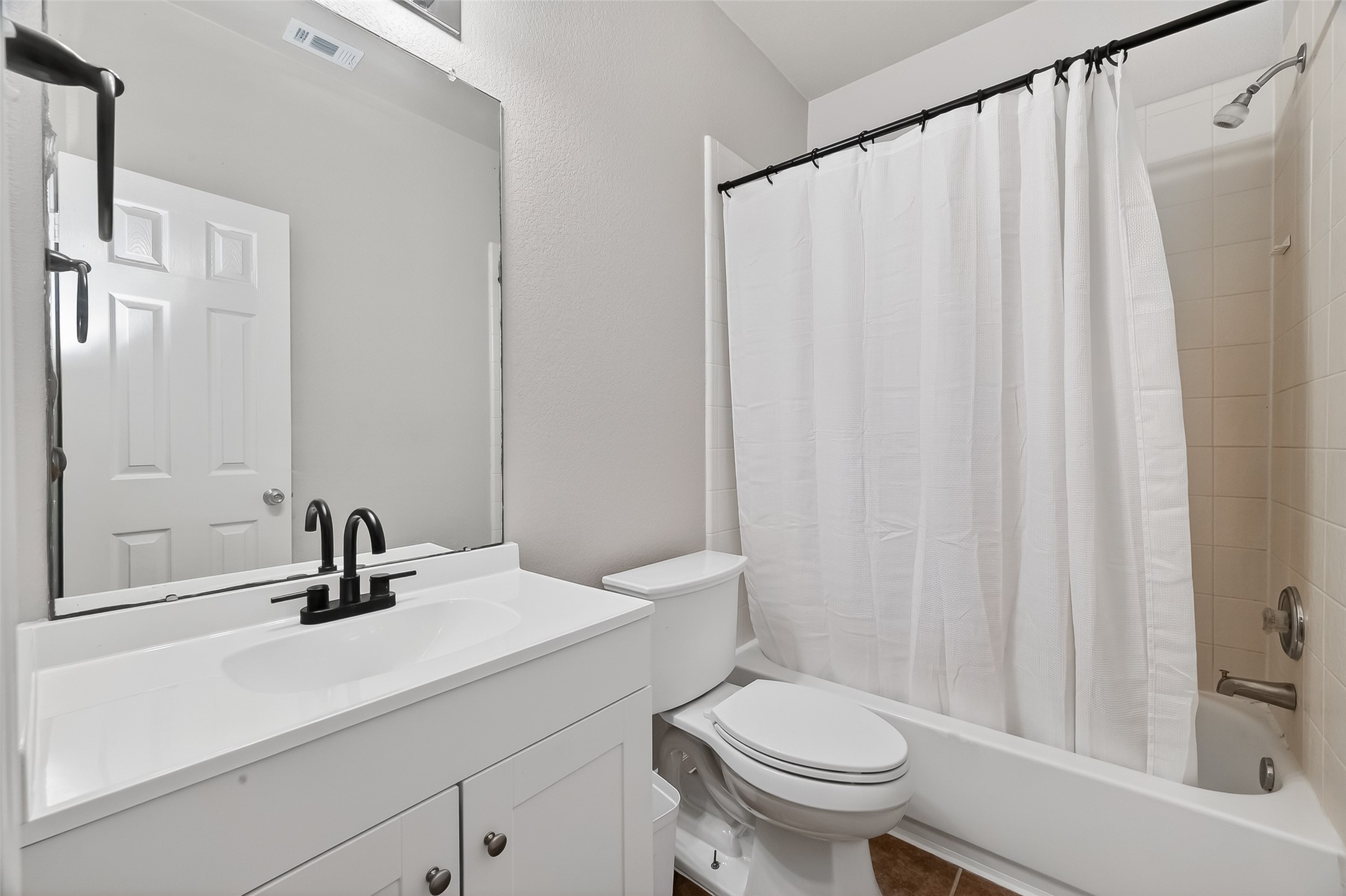 22419 Toronado Ridge Lane Porter, TX 77365 - Photo 22 of 35 a bathroom with a sink a toilet and a mirror