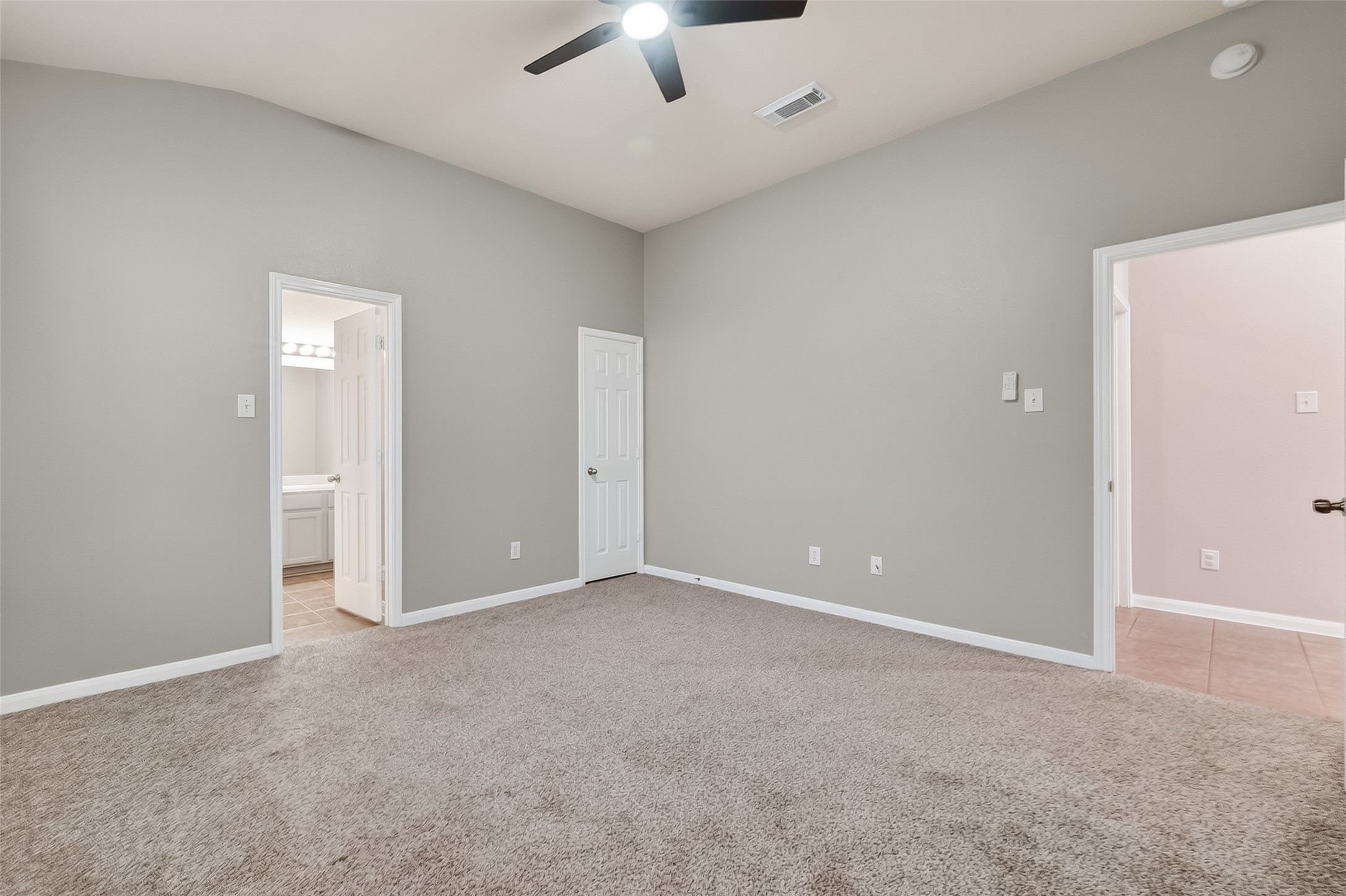 22419 Toronado Ridge Lane Porter, TX 77365 - Photo 25 of 35 an empty room with a empty space and a ceiling fan