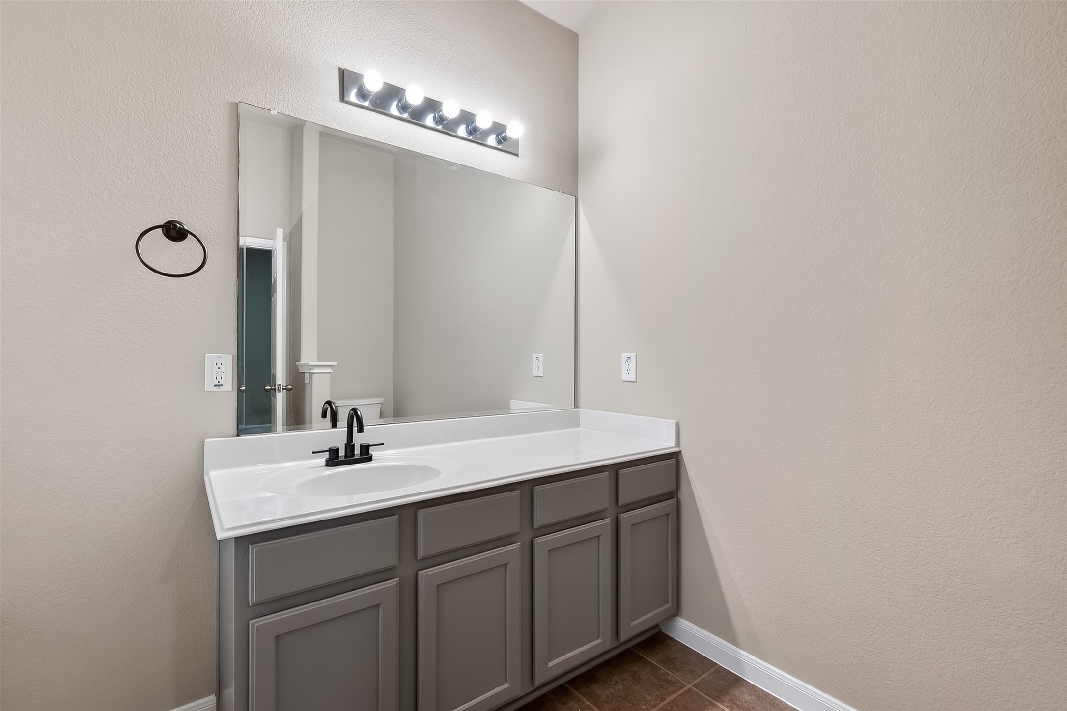 22419 Toronado Ridge Lane Porter, TX 77365 - Photo 26 of 35 a bathroom with a double vanity sink and a mirror