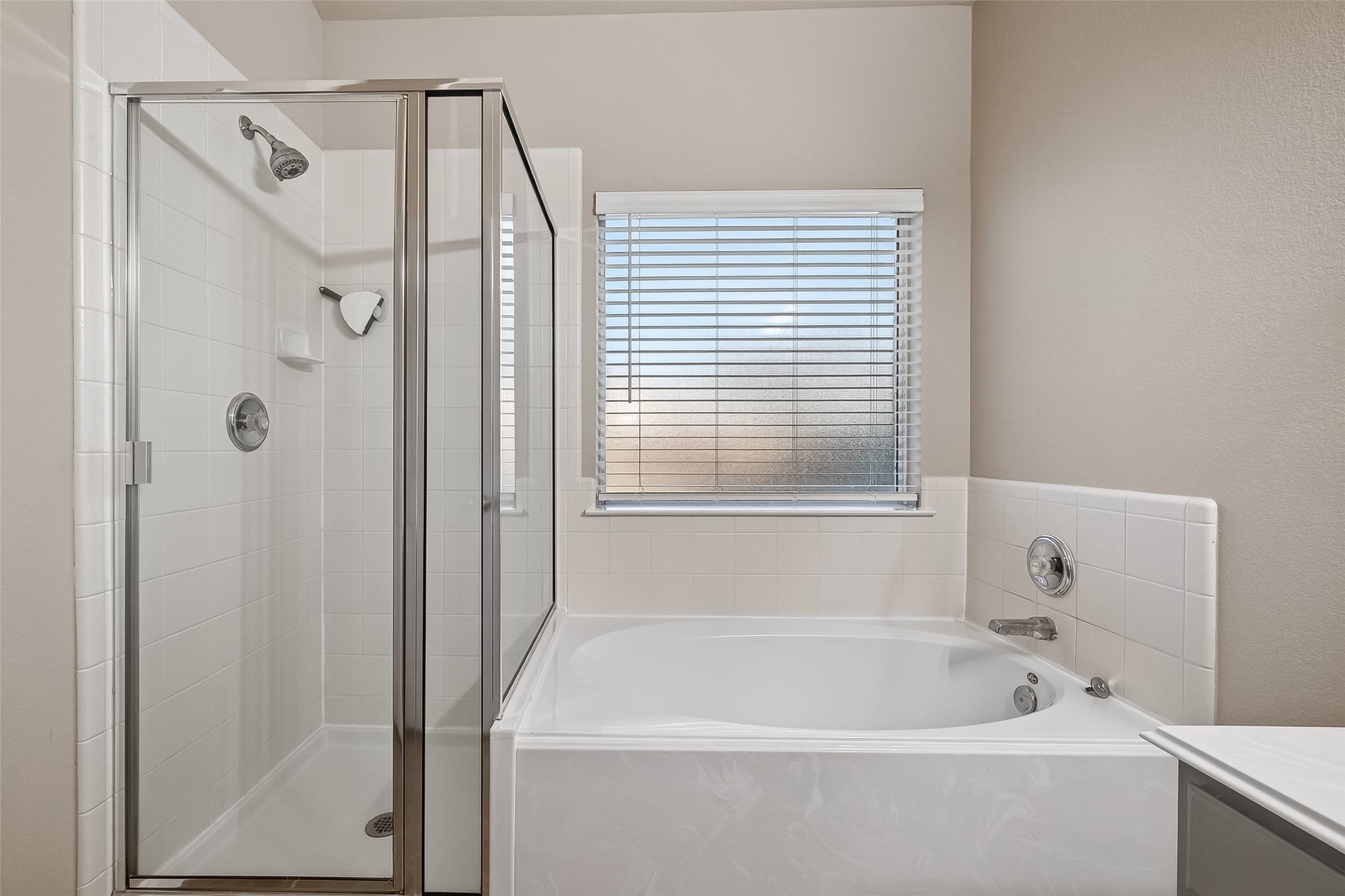 22419 Toronado Ridge Lane Porter, TX 77365 - Photo 27 of 35 a bathroom with a bathtub and a shower