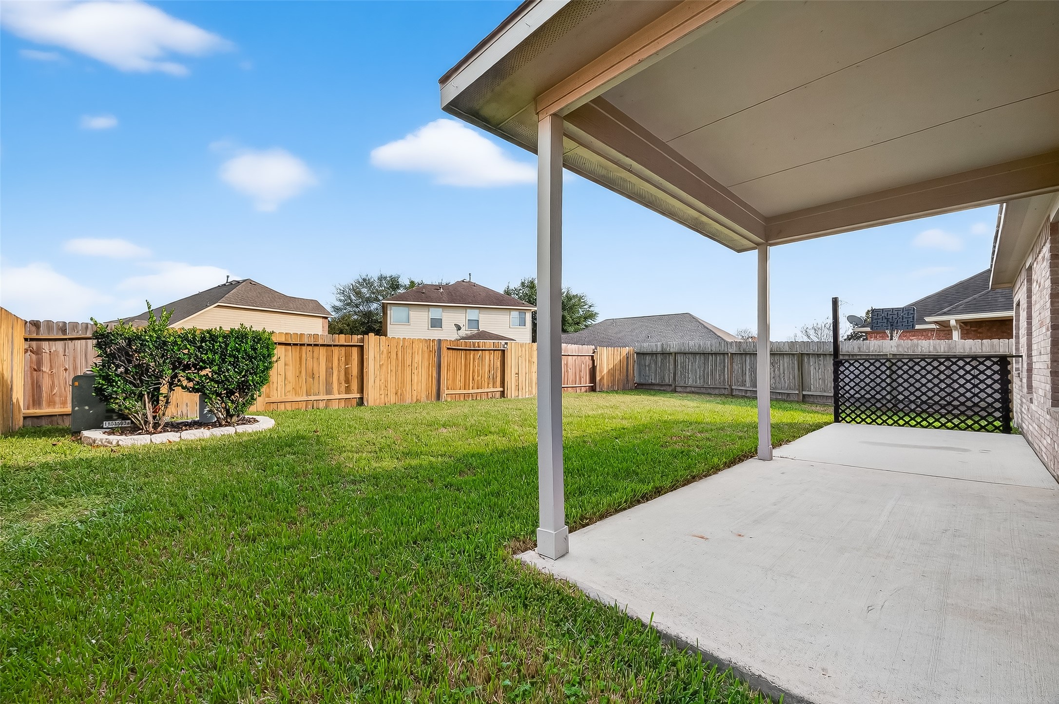 22419 Toronado Ridge Lane Porter, TX 77365 - Photo 35 of 35 a view of a backyard with couches under an umbrella