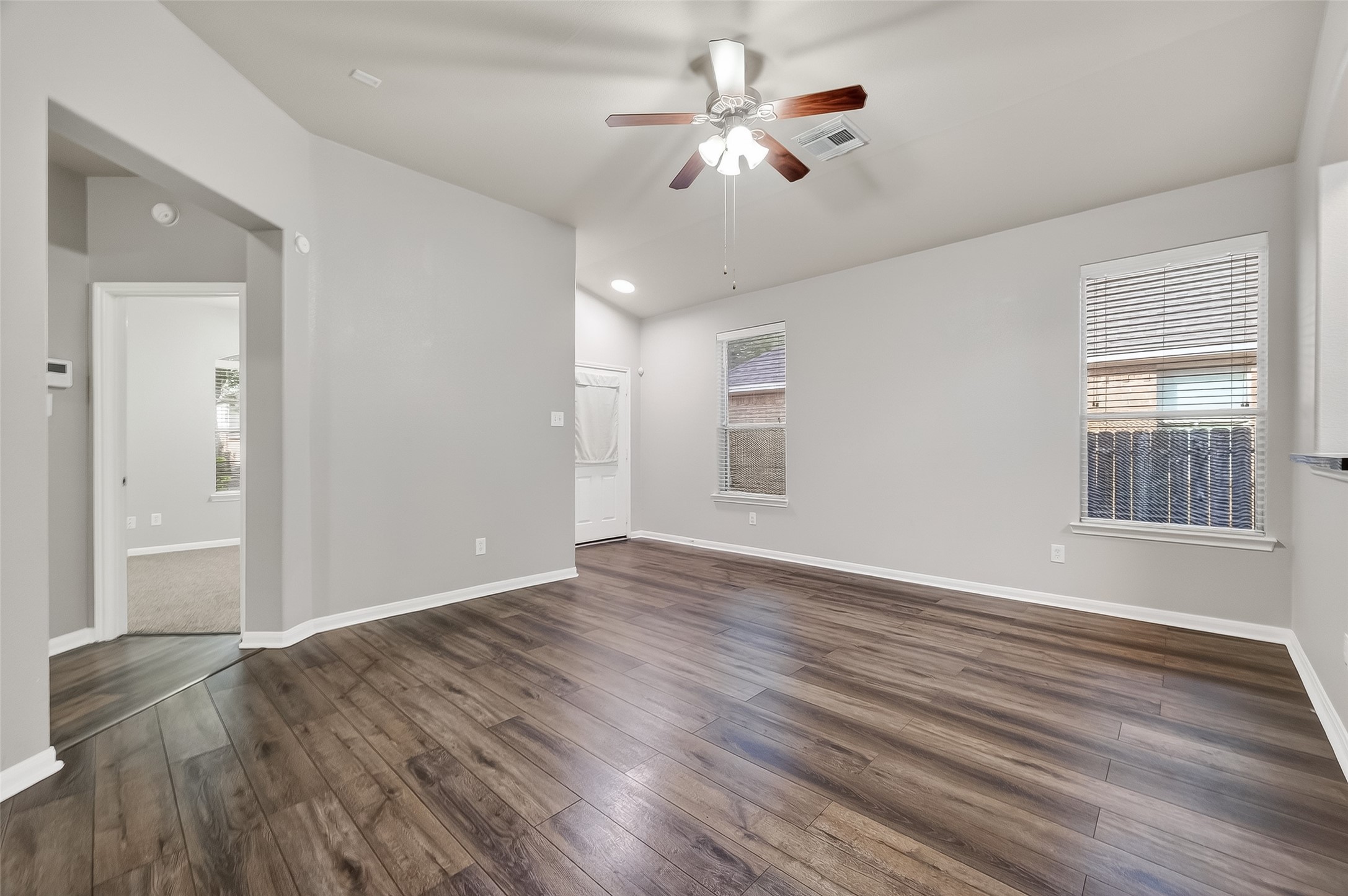 22419 Toronado Ridge Lane Porter, TX 77365 - Photo 6 of 35 a view of an empty room with a window and wooden floor