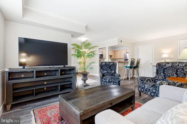 a view of kitchen with furniture and wooden floor