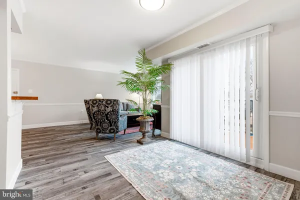 a view of a balcony with wooden floor