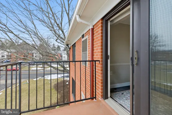 a room with furniture and a potted plant
