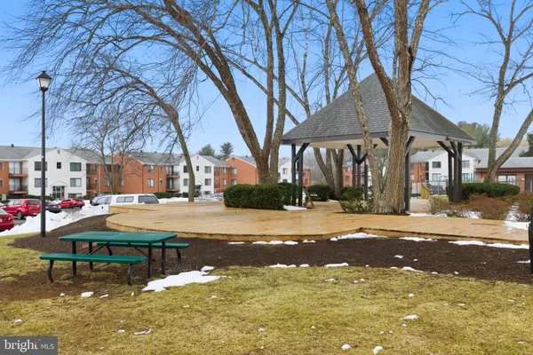 a swimming pool with outdoor seating and yard