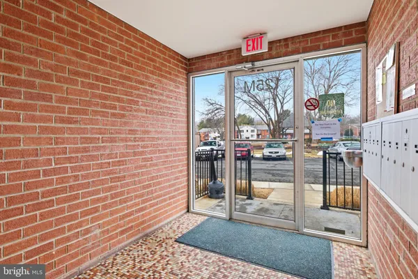 a view of a brick wall with a door