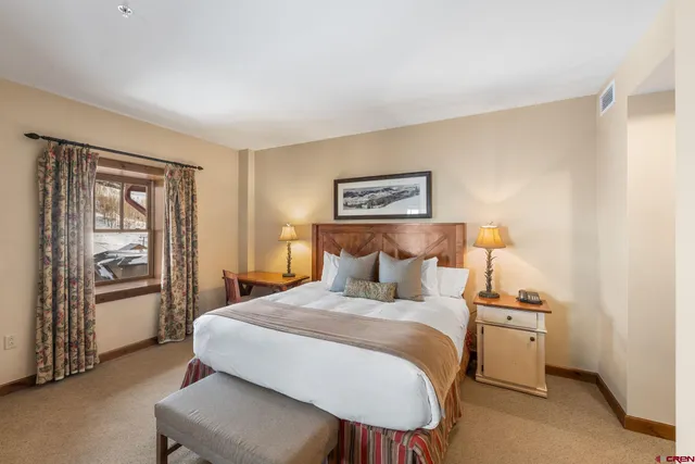 a bedroom with a bed and a cabinets