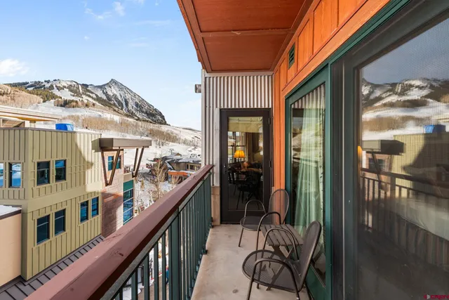 a view of a balcony and chairs