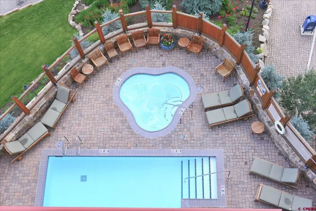an aerial view of a house with a swimming pool