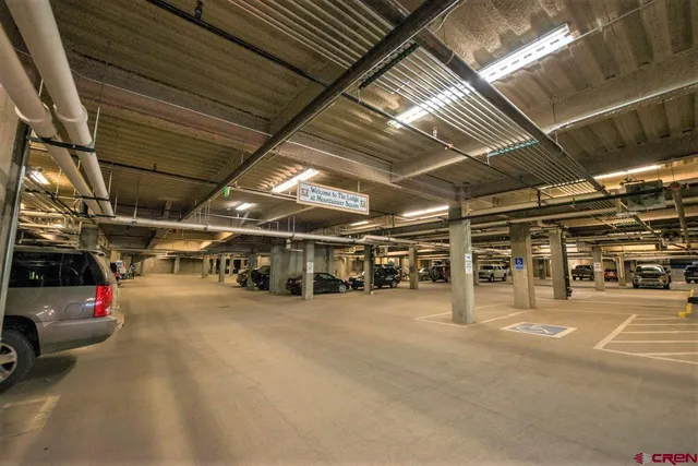 a view of a garage with cars
