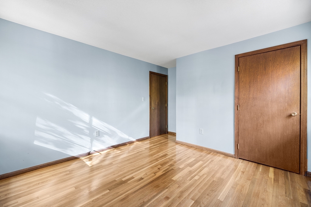 230 Irondequoit Road Franklin, MA 02038 - Photo 13 of 36 a view of empty room with wooden floor