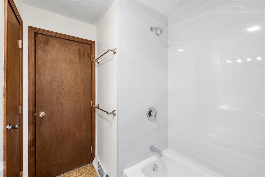 230 Irondequoit Road Franklin, MA 02038 - Photo 21 of 36 a bathroom with a shower and a tub