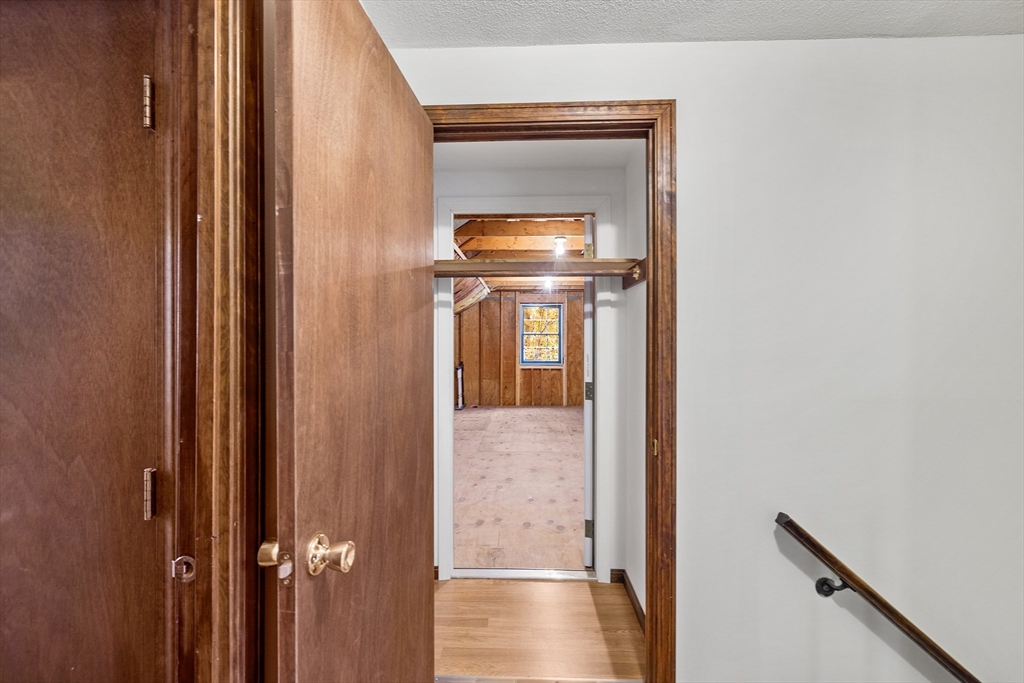 230 Irondequoit Road Franklin, MA 02038 - Photo 22 of 36 a view of a hallway with wooden floor