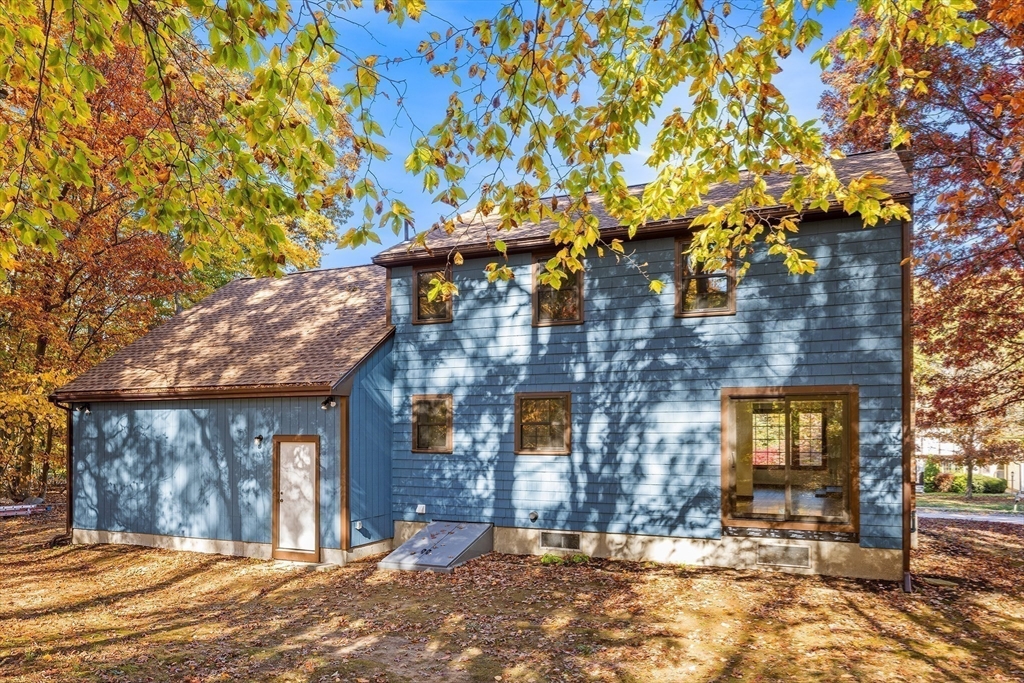 230 Irondequoit Road Franklin, MA 02038 - Photo 30 of 36 a view of a brick house with large windows